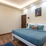 Grey Hues With Swimming Pool & Lawn At Karjat By Stayvista