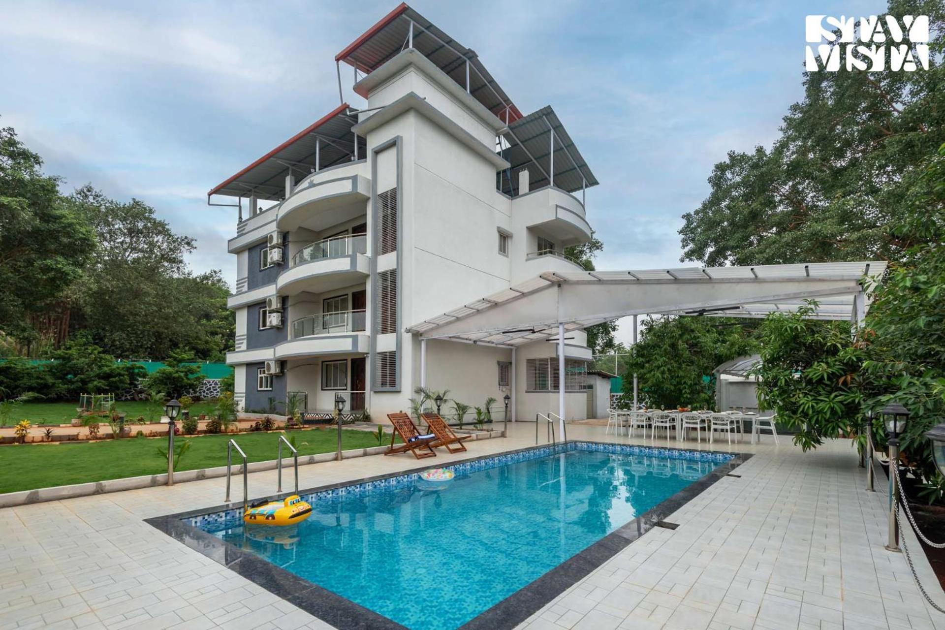 Grey Hues With Swimming Pool & Lawn At By Stayvista Villa *